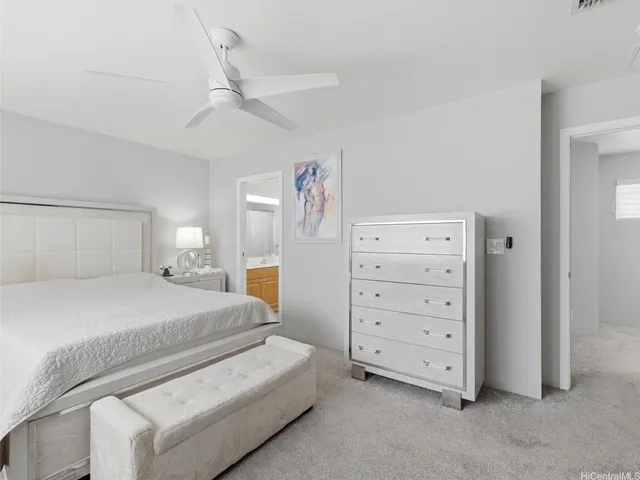 a bedroom with a bed and a dresser