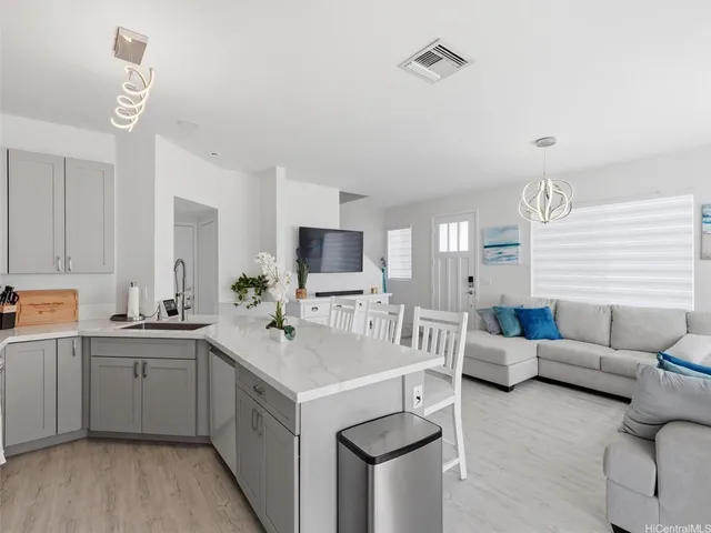 a view of living room with furniture and fireplace