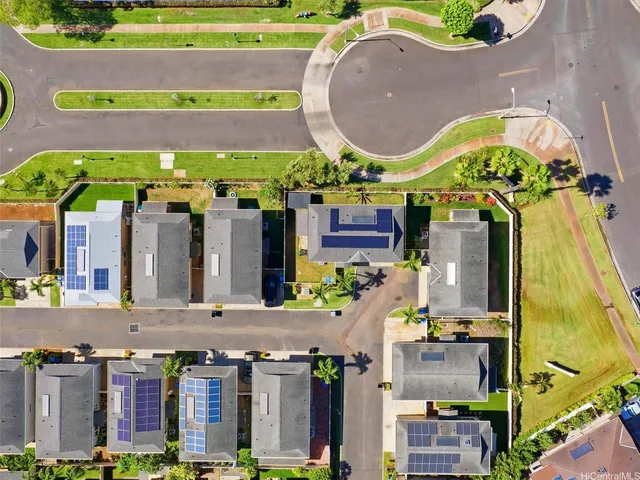 an aerial view of a building with a swimming pool