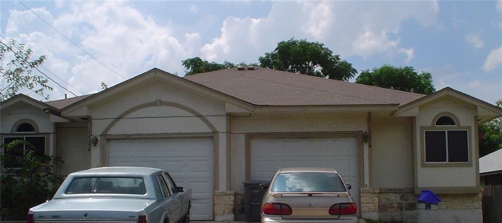 a front view of a house with parking
