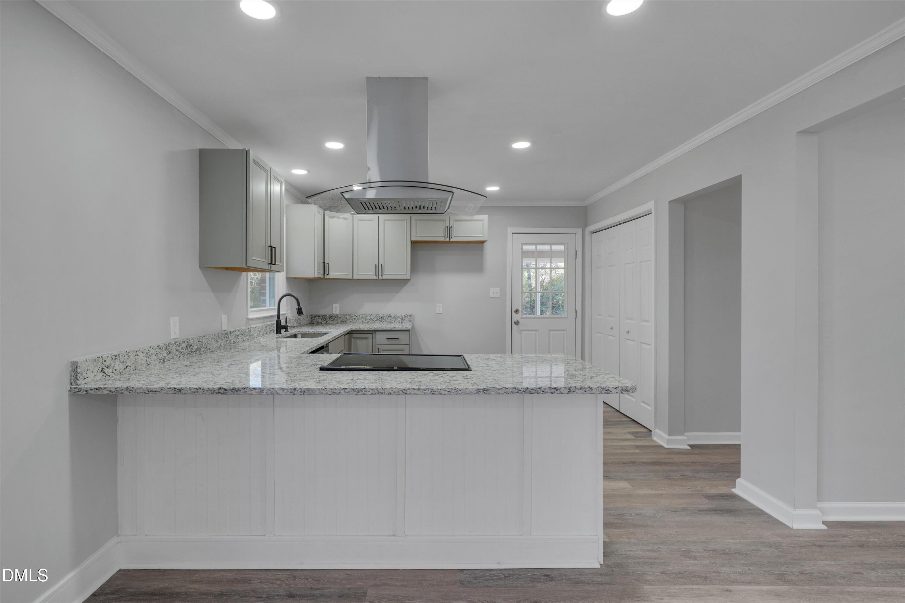 2728 South Cokesbury Road Henderson, NC 27537 - Photo 10 of 40 a kitchen with stainless steel appliances granite countertop a sink a refrigerator and a granite counter tops