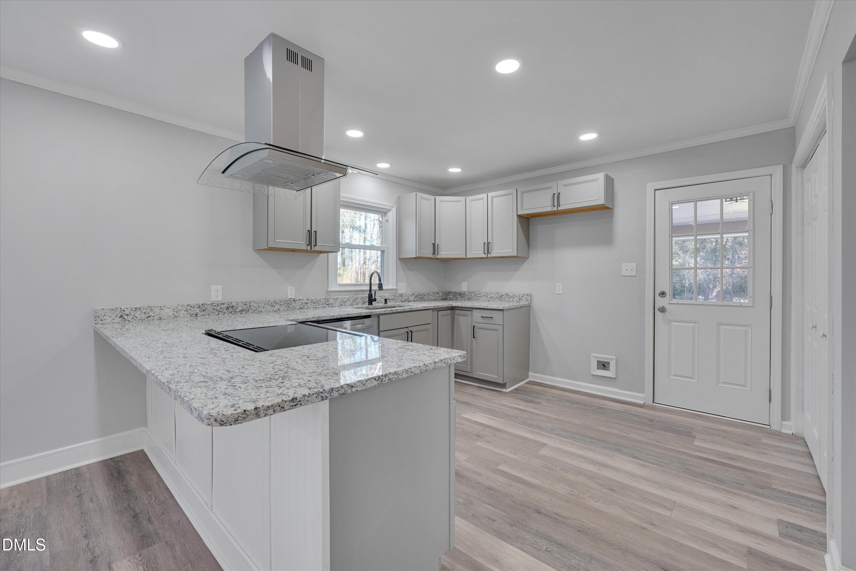 2728 South Cokesbury Road Henderson, NC 27537 - Photo 11 of 40 a kitchen with stainless steel appliances granite countertop a sink stove and refrigerator
