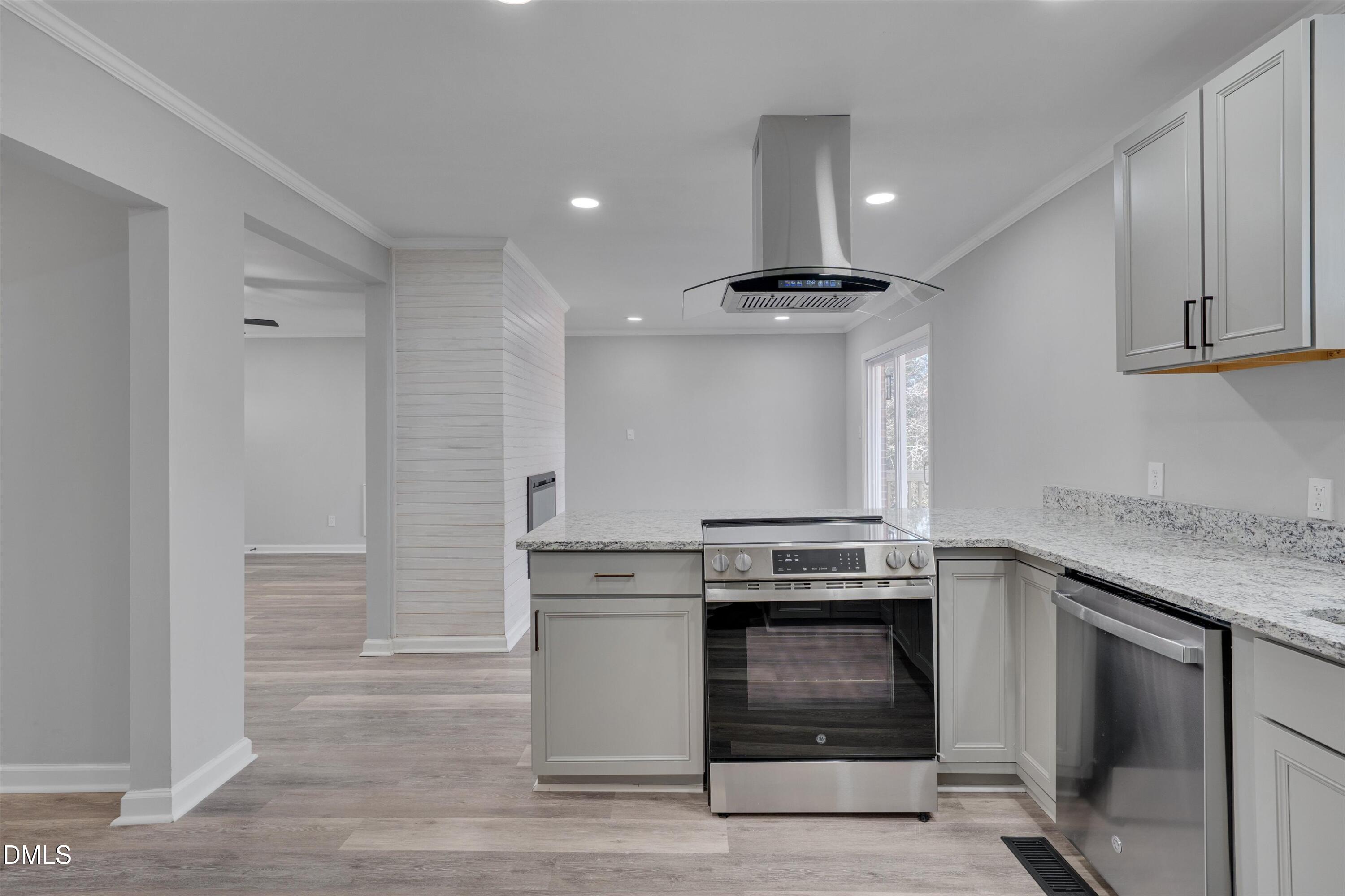 2728 South Cokesbury Road Henderson, NC 27537 - Photo 13 of 40 a kitchen with a stove and a sink