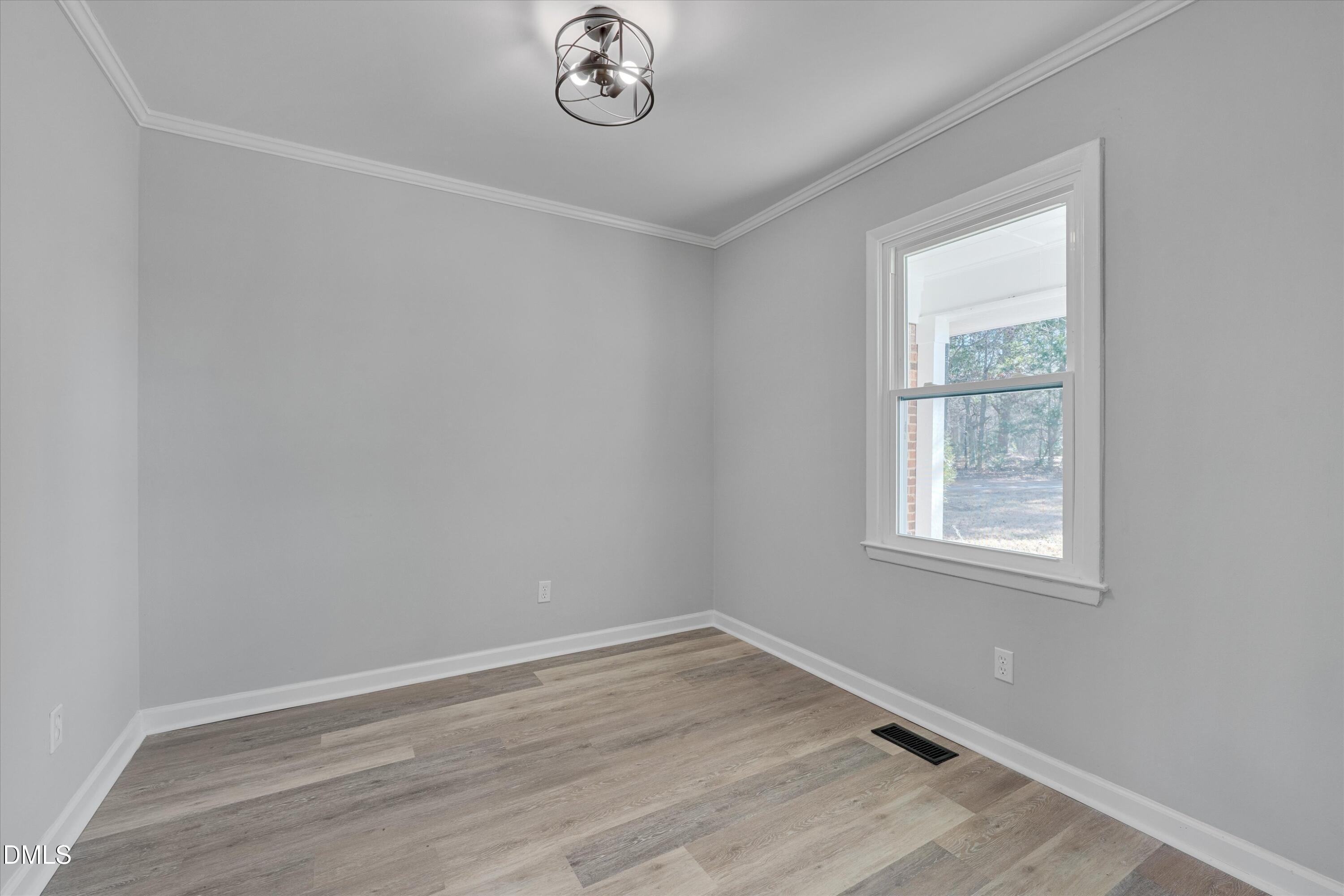 2728 South Cokesbury Road Henderson, NC 27537 - Photo 15 of 40 an empty room with a window