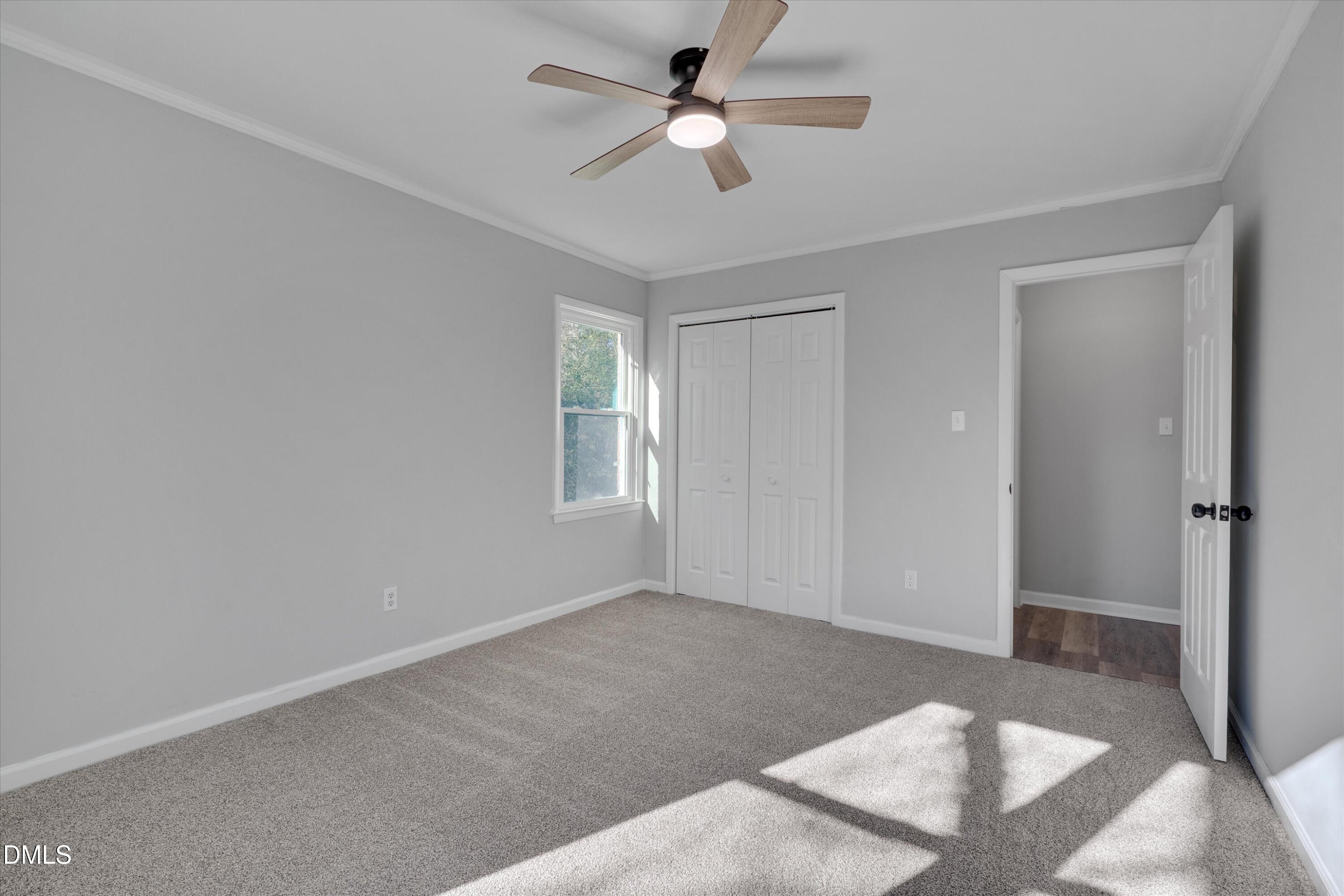 2728 South Cokesbury Road Henderson, NC 27537 - Photo 25 of 40 a view of a room with a ceiling fan and a window