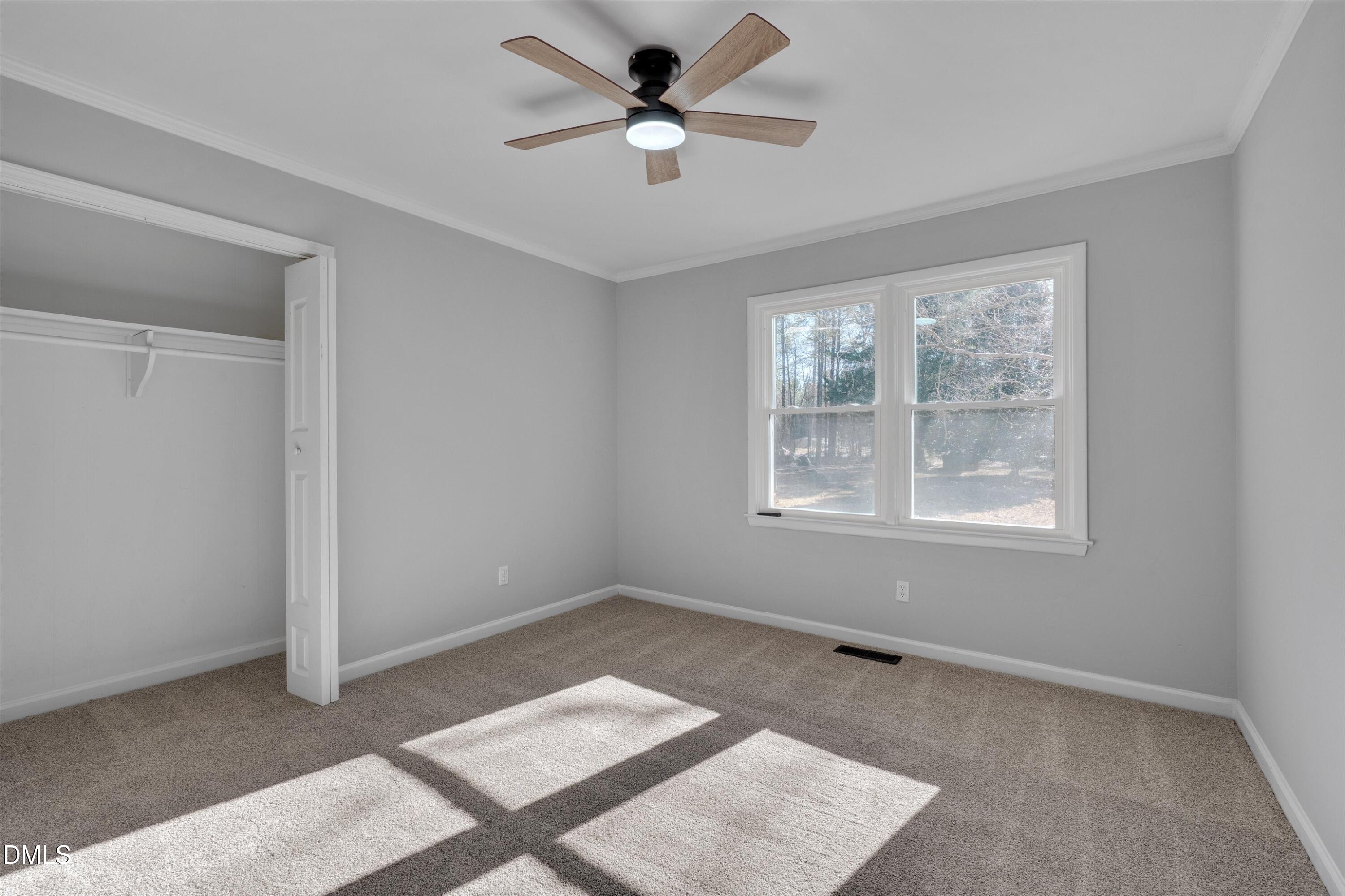 2728 South Cokesbury Road Henderson, NC 27537 - Photo 26 of 40 a view of an empty room with a window