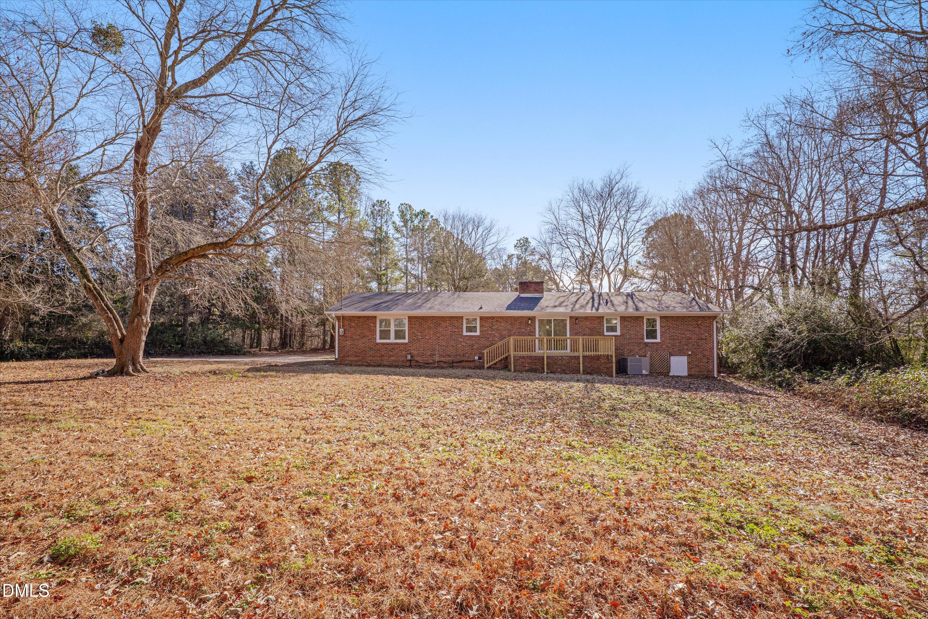 2728 South Cokesbury Road Henderson, NC 27537 - Photo 36 of 40 a house with trees in front of it