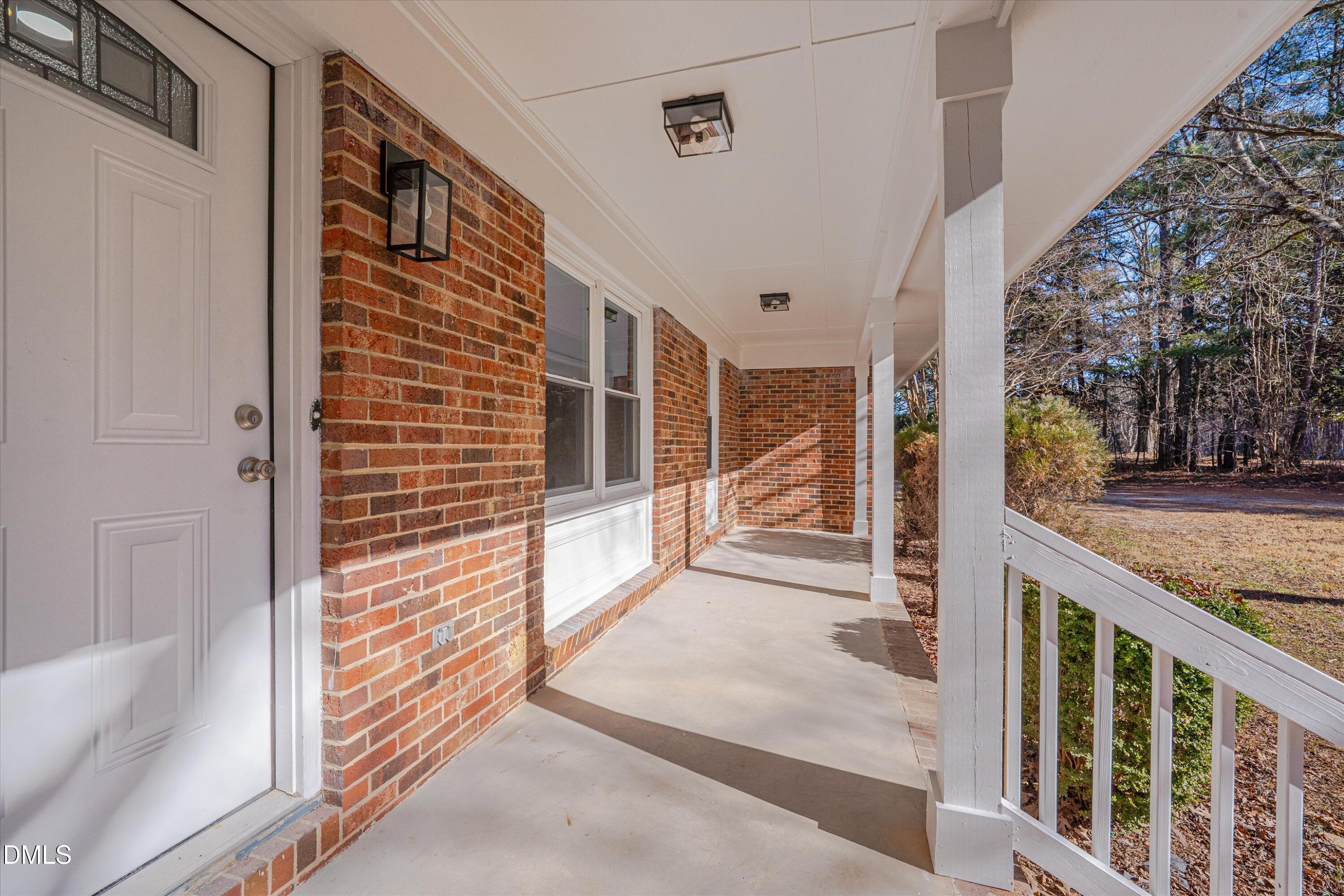 2728 South Cokesbury Road Henderson, NC 27537 - Photo 3 of 40 a view of a porch