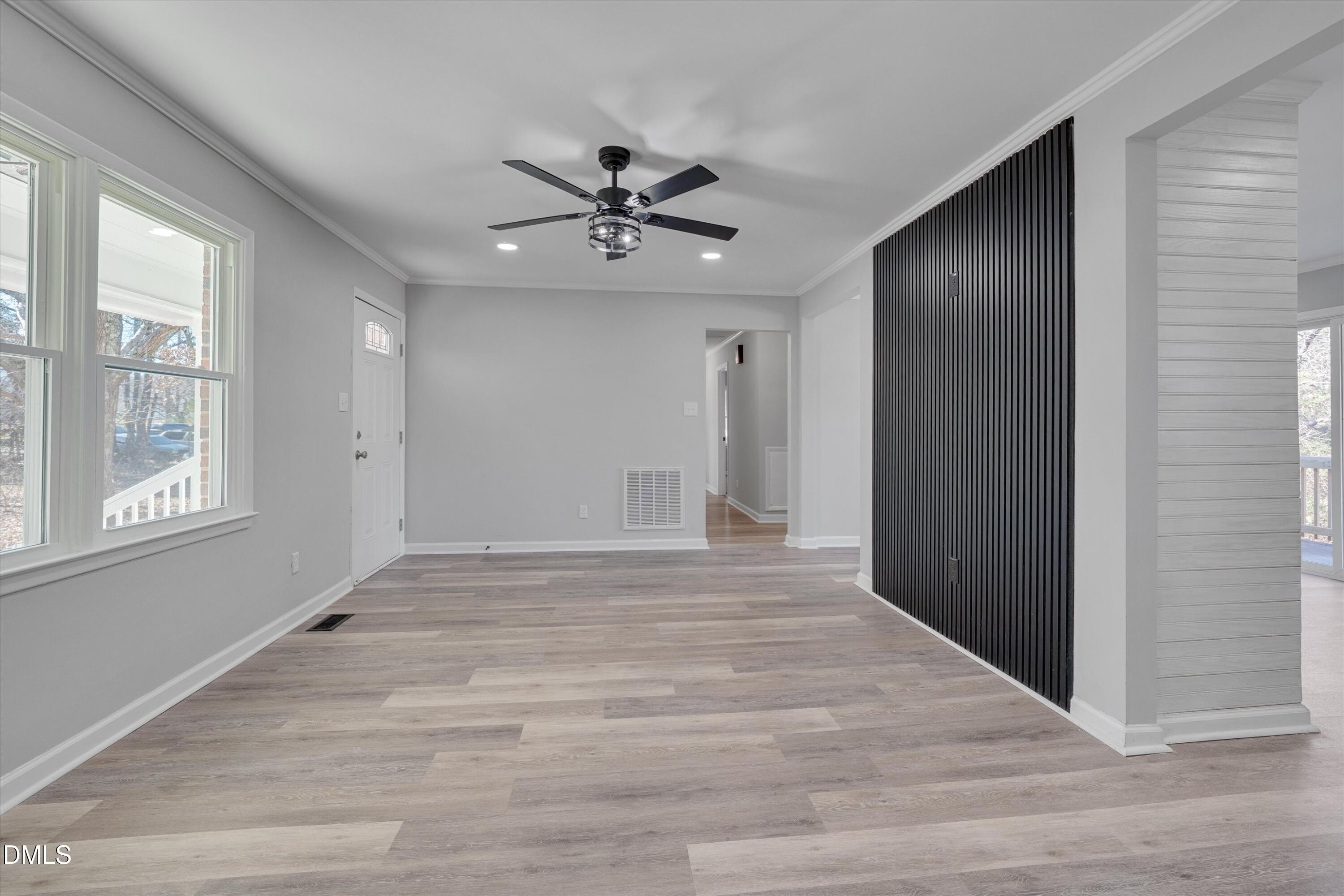 2728 South Cokesbury Road Henderson, NC 27537 - Photo 6 of 40 a view of an empty room with a window
