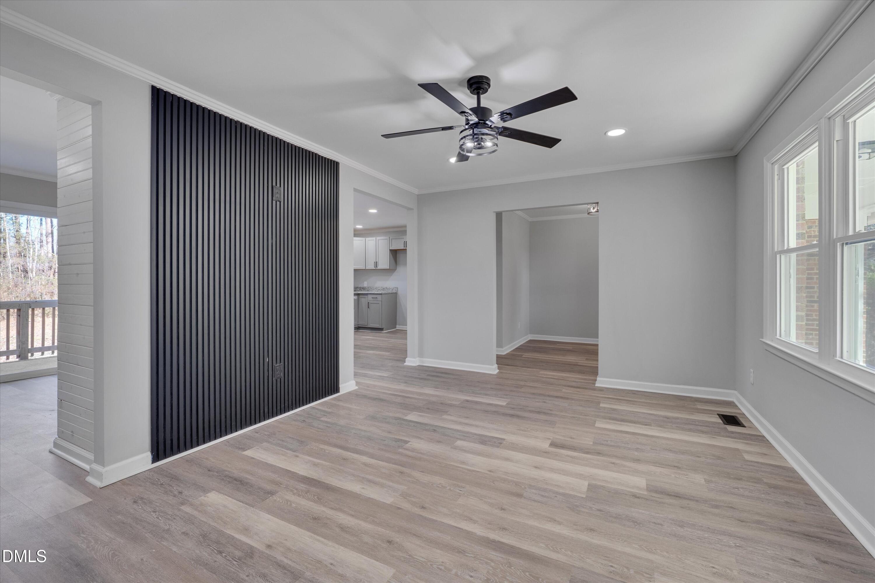 2728 South Cokesbury Road Henderson, NC 27537 - Photo 7 of 40 a view of empty room with wooden floor and window