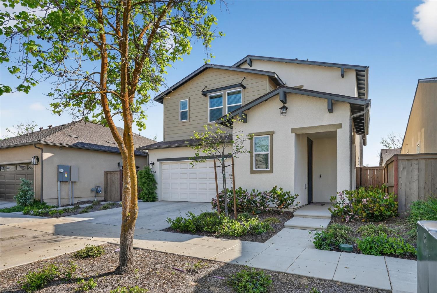 824 Katelyn Avenue Madera, CA 93636 - Photo 1 of 31 a front view of a house with a yard and garage