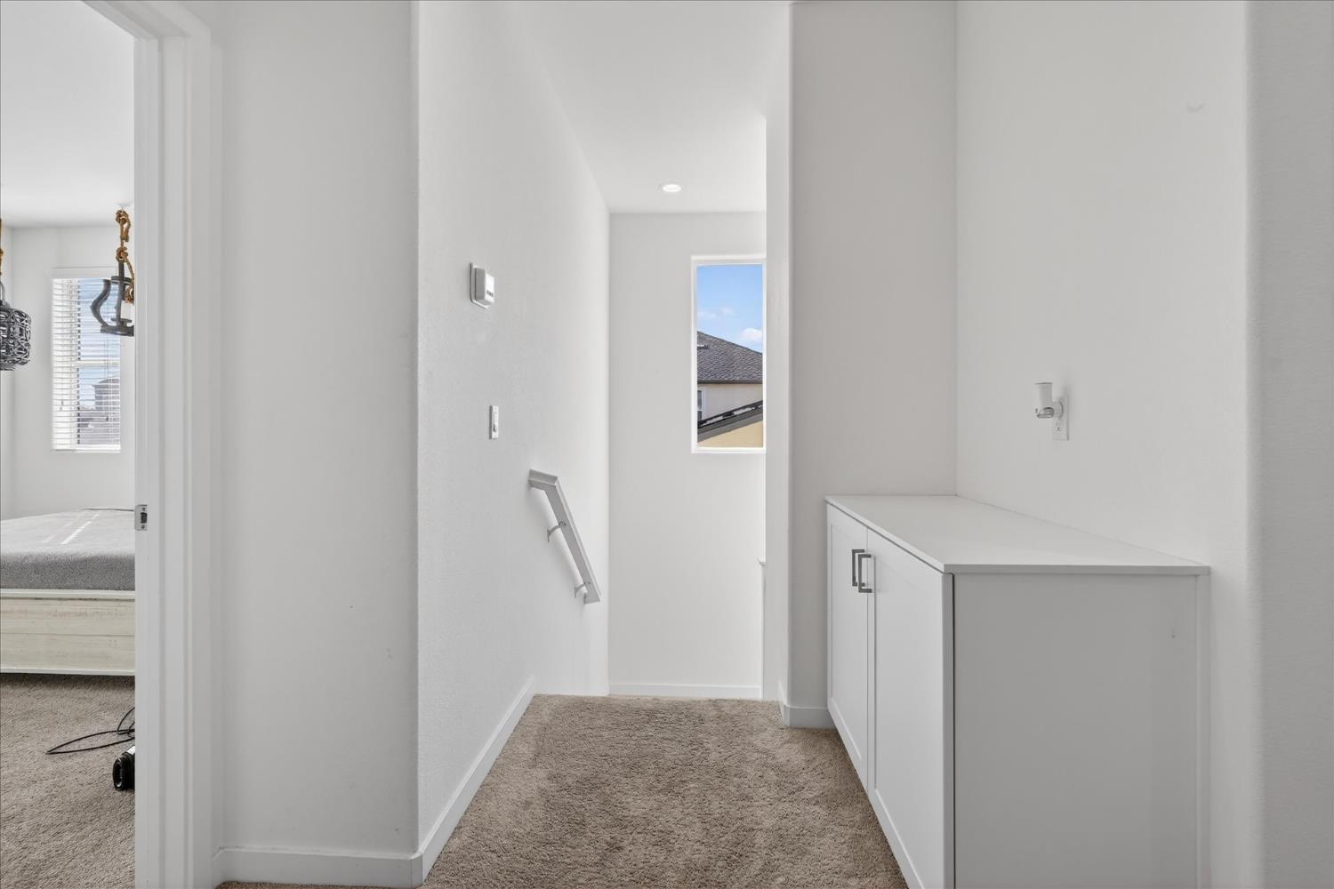 824 Katelyn Avenue Madera, CA 93636 - Photo 16 of 31 a view of hallway with wooden floor