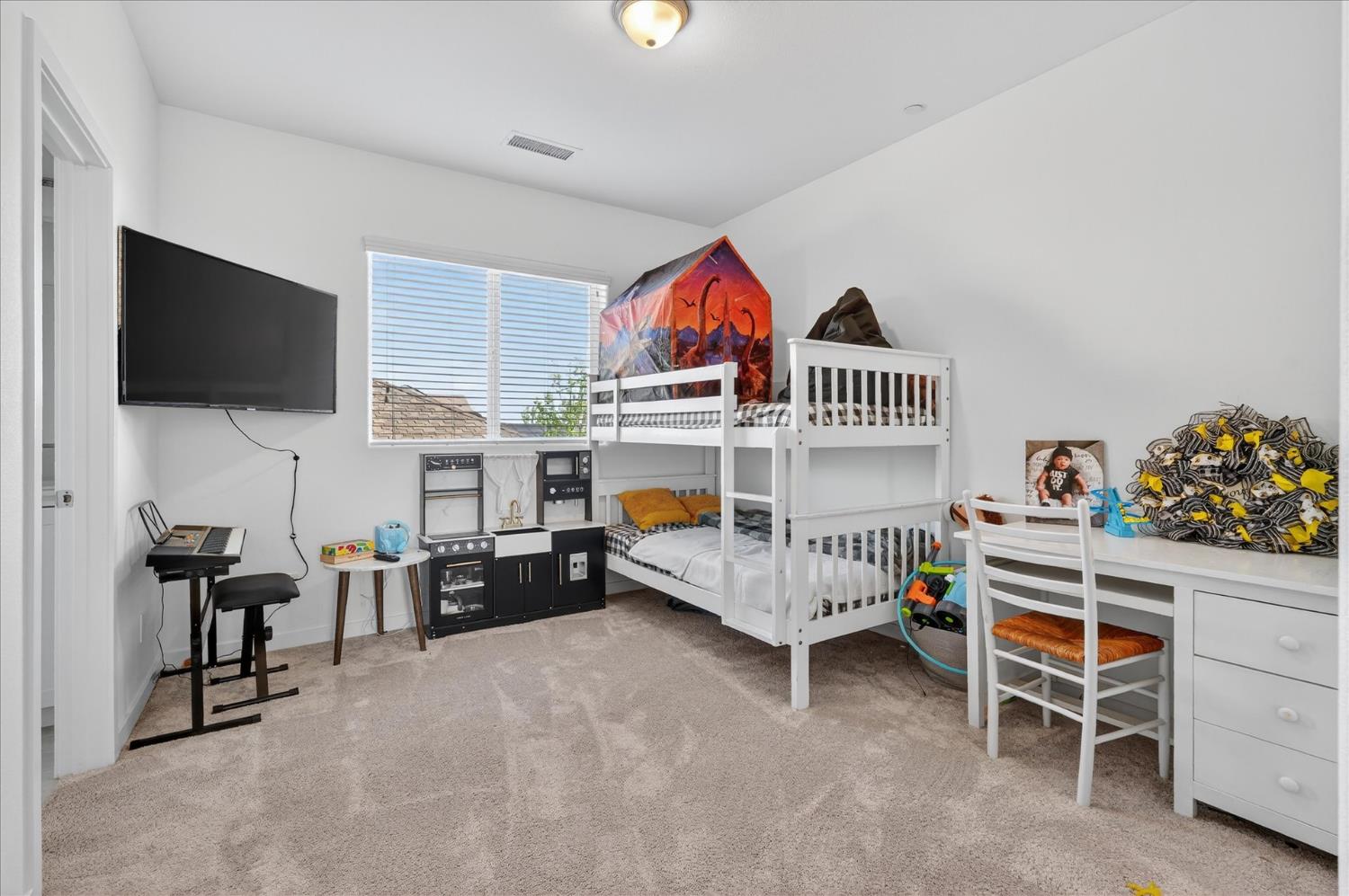 824 Katelyn Avenue Madera, CA 93636 - Photo 17 of 31 a bedroom with furniture and a window