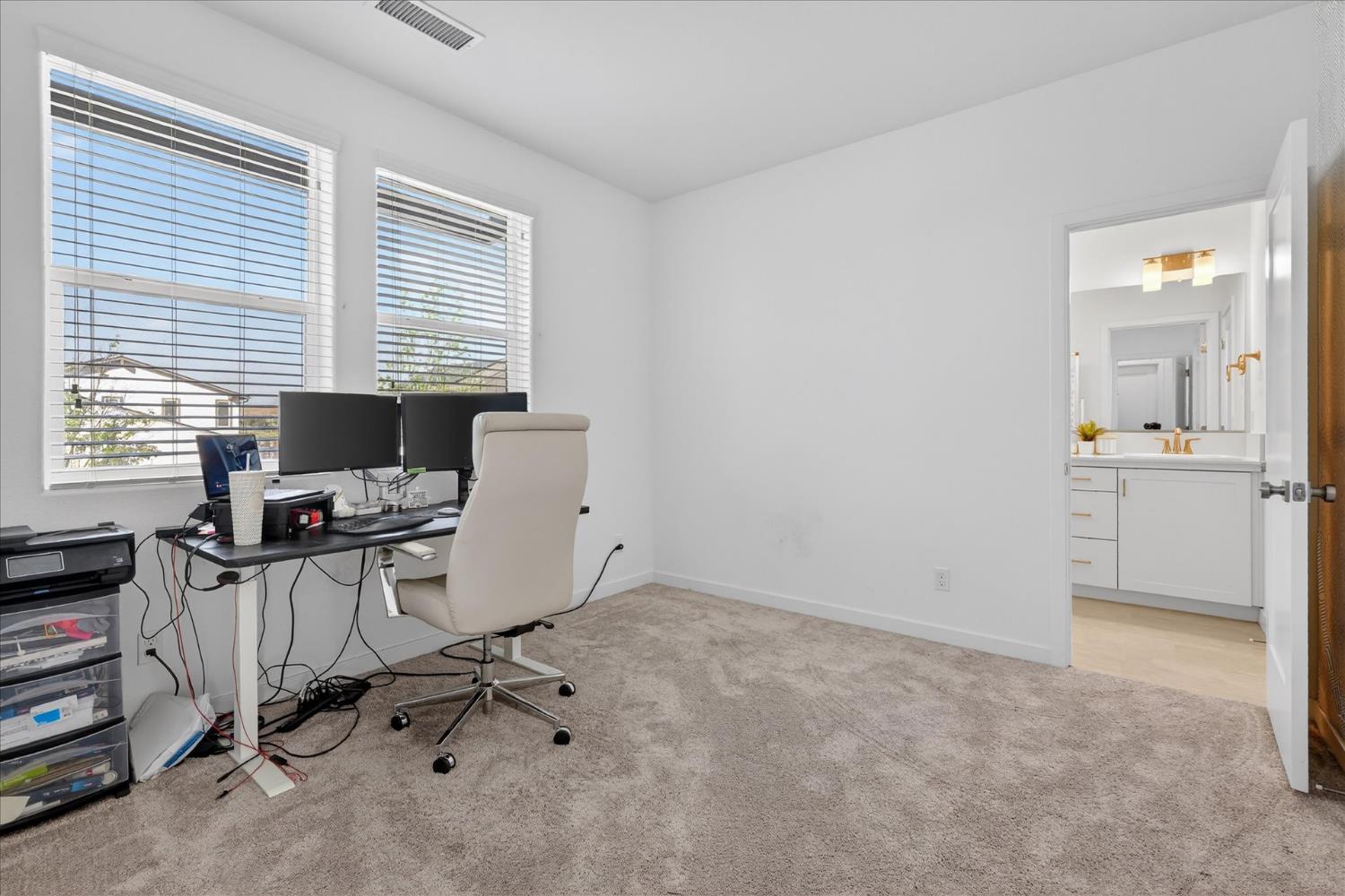 824 Katelyn Avenue Madera, CA 93636 - Photo 21 of 31 a view of a workspace with furniture and a window