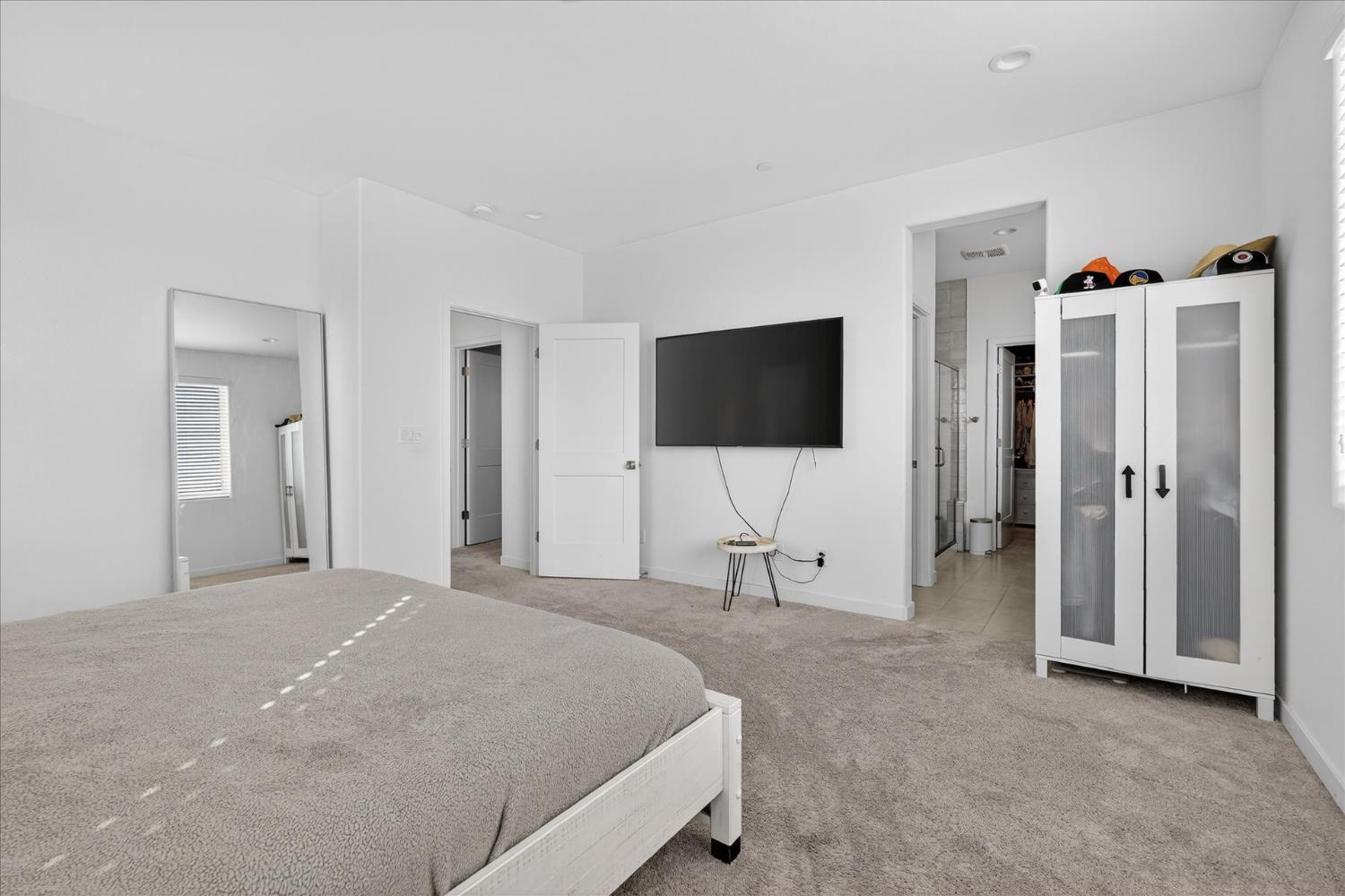 824 Katelyn Avenue Madera, CA 93636 - Photo 25 of 31 a bedroom with a bed and a flat screen tv