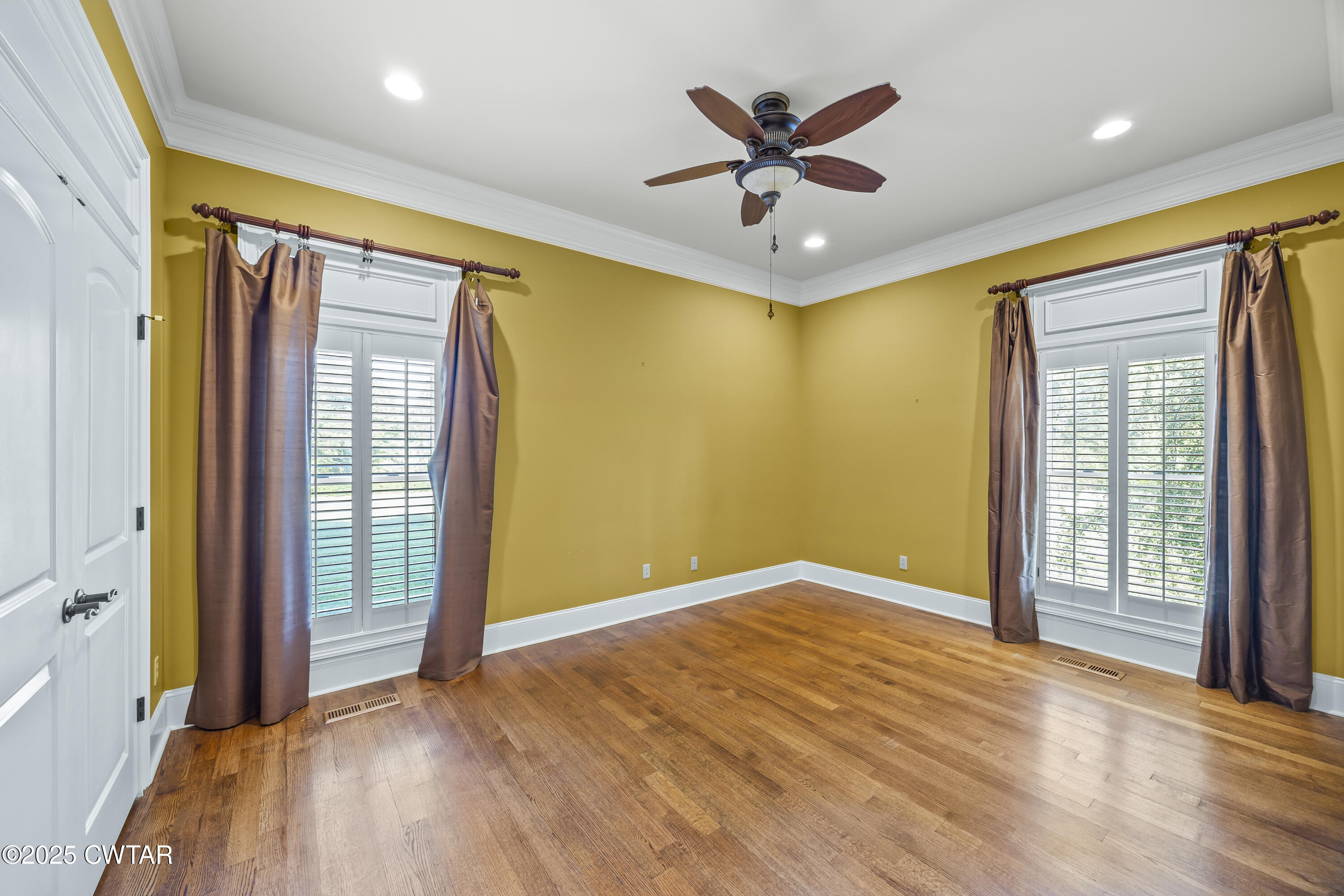 2755 Hornsby Loop Bolivar, TN 38008 - Photo 17 of 28 an empty room with windows and ceiling fan