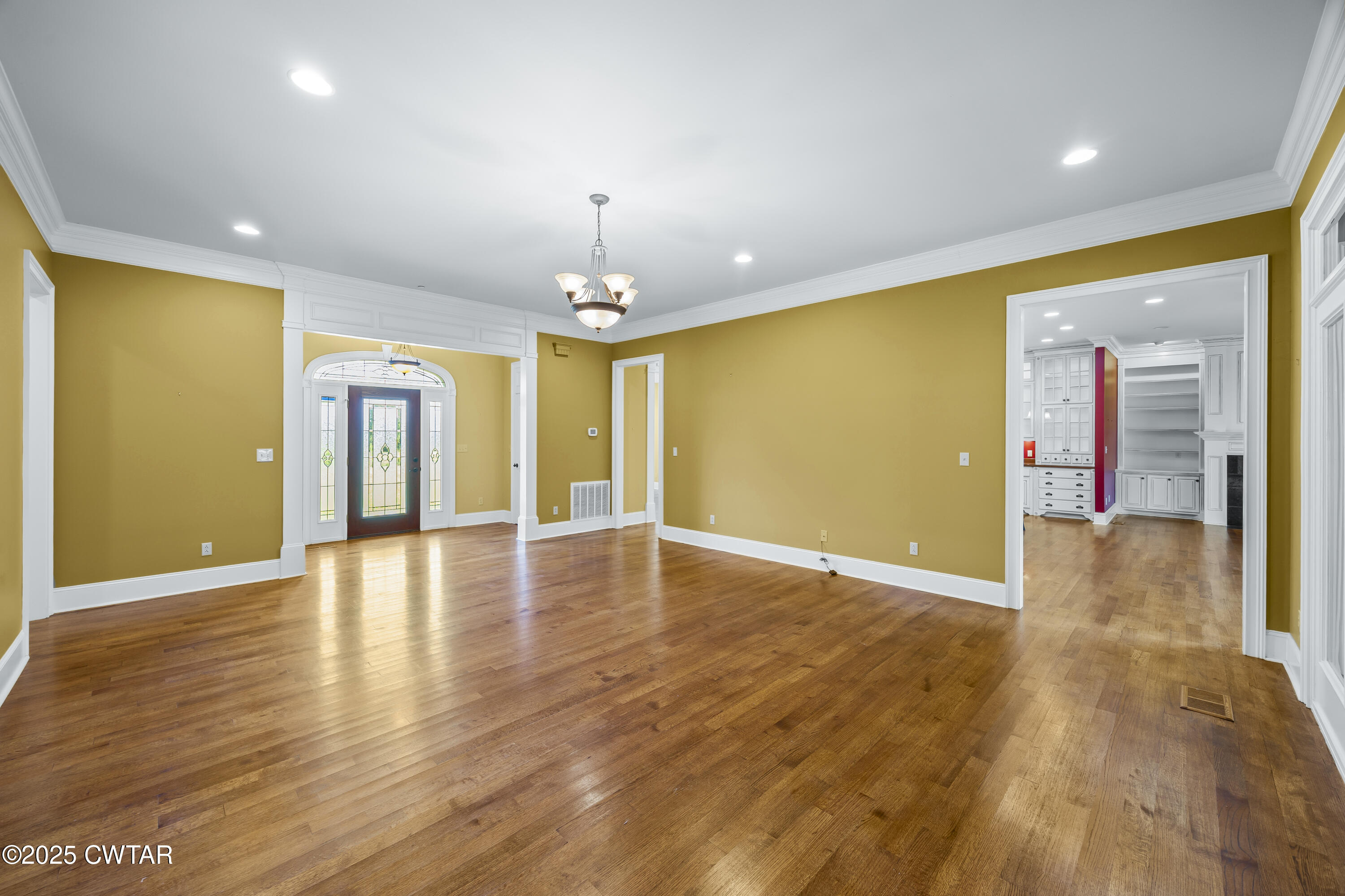 2755 Hornsby Loop Bolivar, TN 38008 - Photo 2 of 28 a view of an empty room with wooden floor and a window