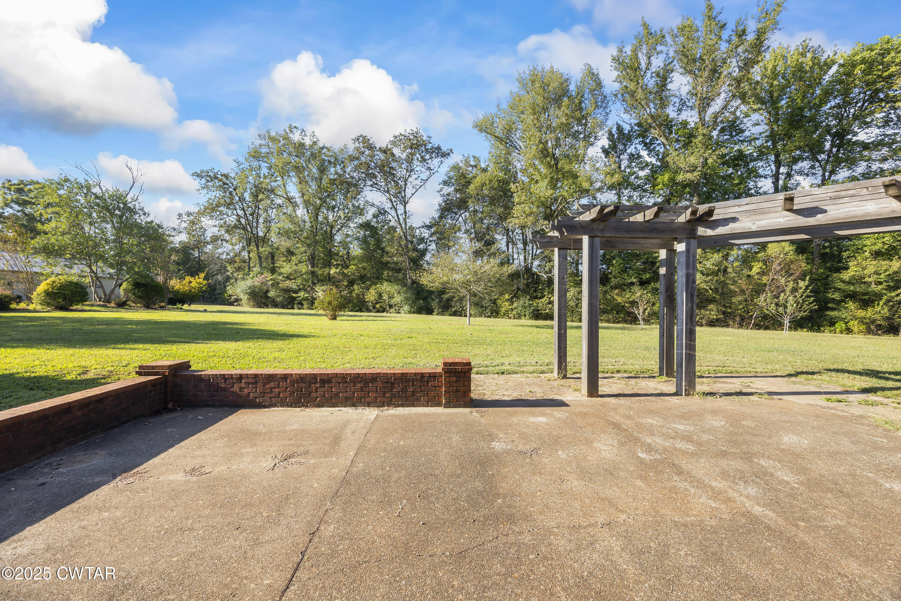 2755 Hornsby Loop Bolivar, TN 38008 - Photo 23 of 28 a view of a swimming pool with a yard