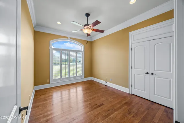 a kitchen with stainless steel appliances kitchen island granite countertop a stove top oven a sink a dining table and chairs