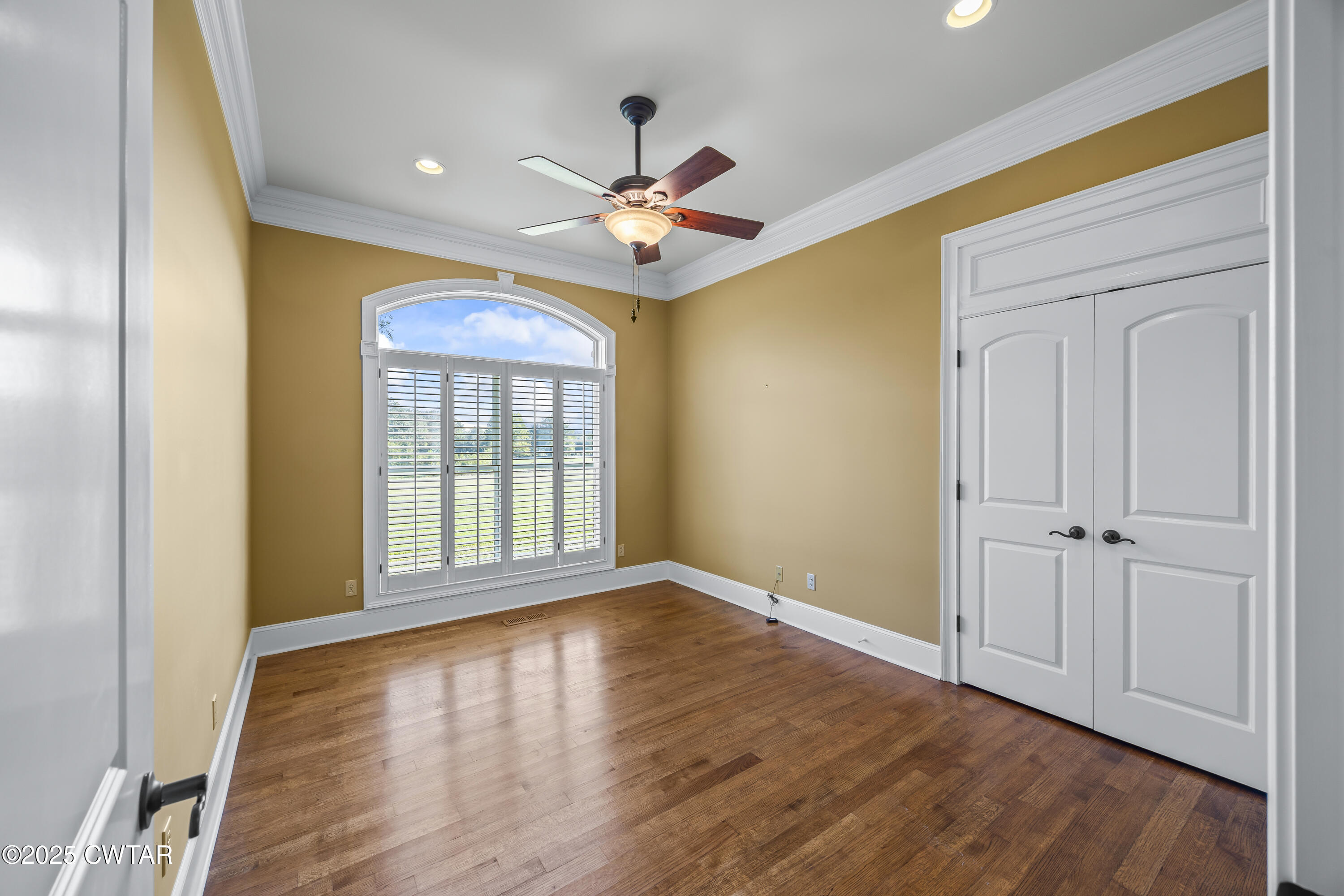 2755 Hornsby Loop Bolivar, TN 38008 - Photo 4 of 28 a view of an empty room with wooden floor and a window
