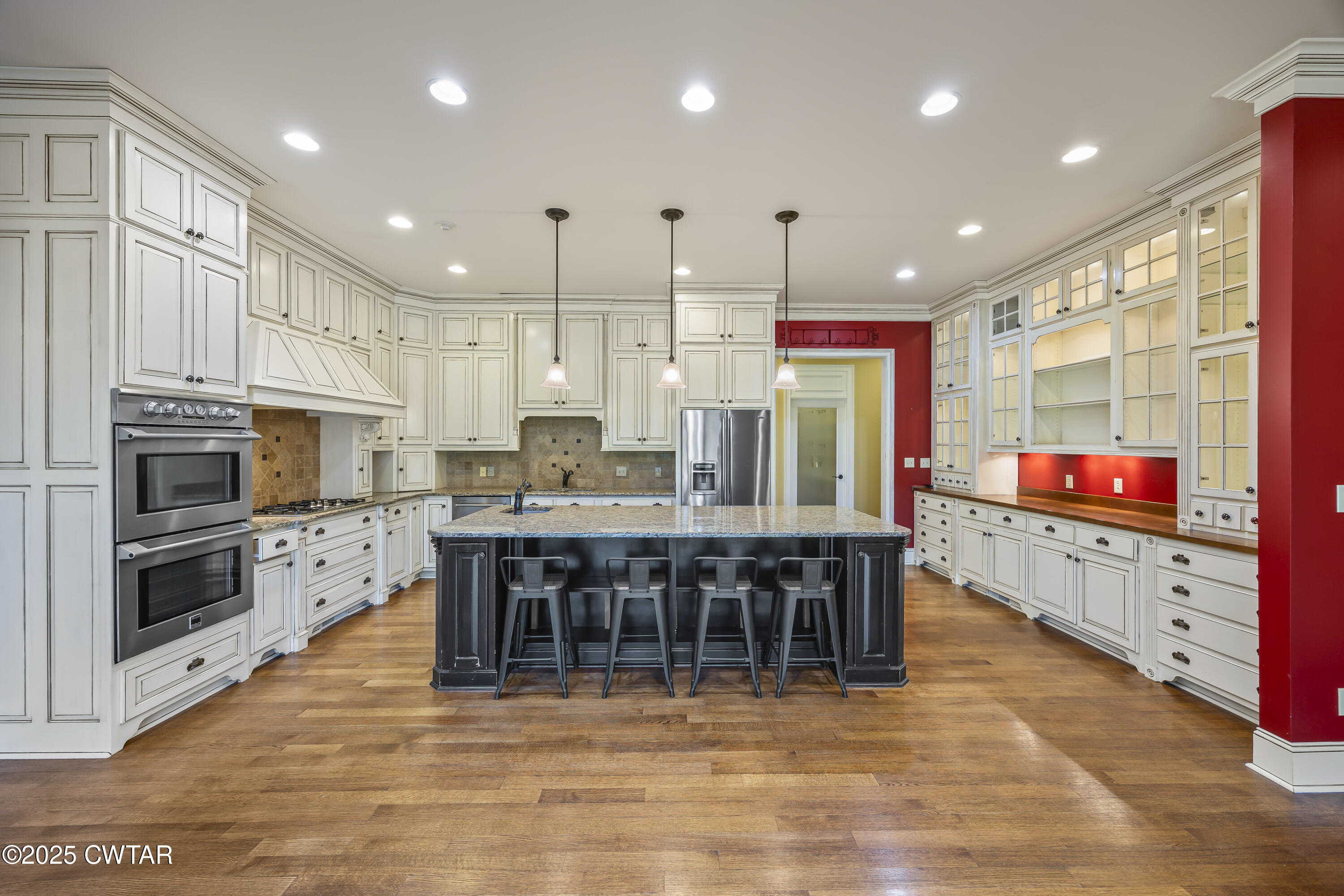 2755 Hornsby Loop Bolivar, TN 38008 - Photo 5 of 28 a kitchen with stainless steel appliances kitchen island granite countertop a stove top oven a sink a dining table and chairs