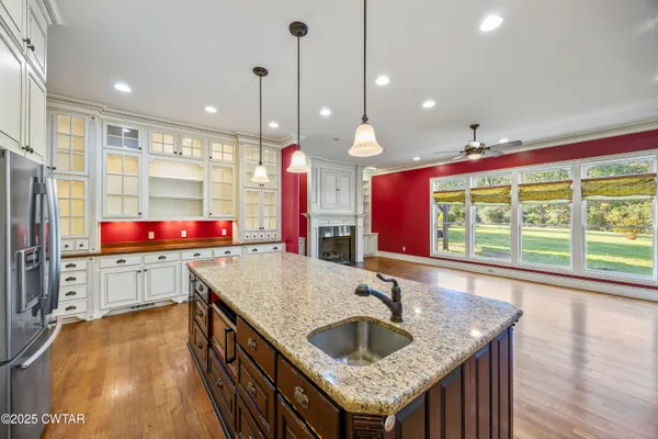 a kitchen with a stove sink and refrigerator