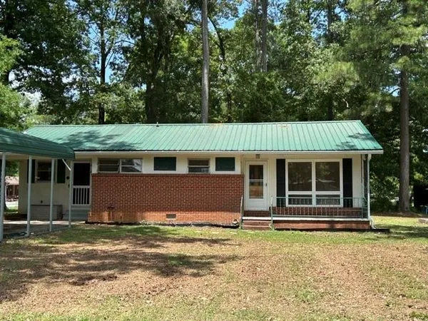 front view of a house with a garden