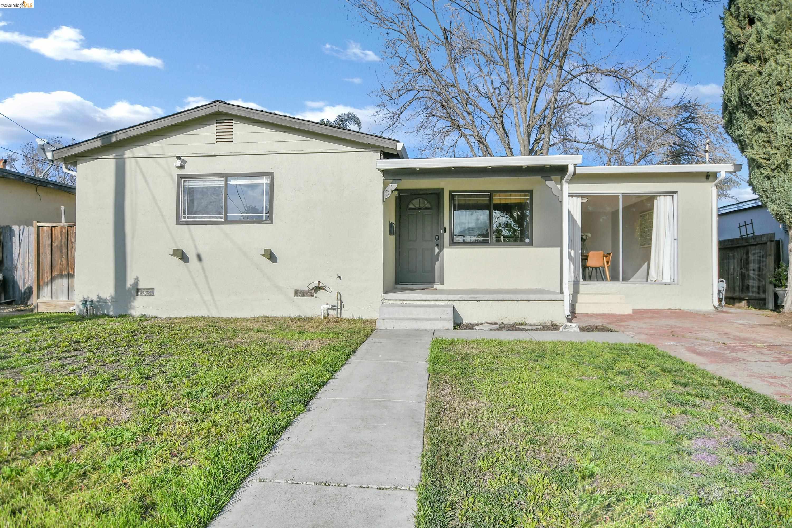 Bungalow-style home with crawl space, stucco siding, and covered porch