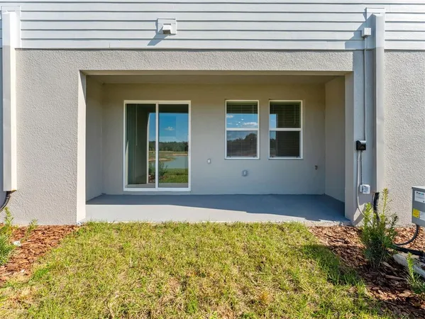 a view of house with backyard
