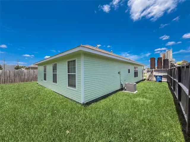 a backyard of a house with lots of green space