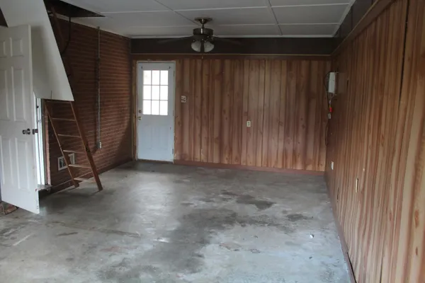 a view of an empty room with a fireplace