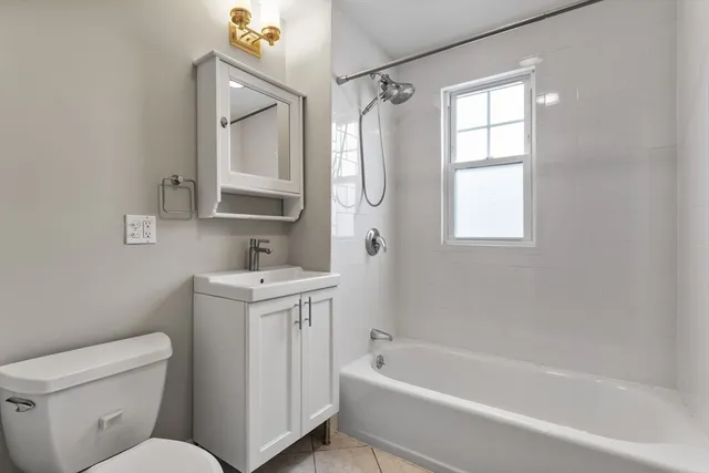 a bathroom with a sink toilet and bathtub