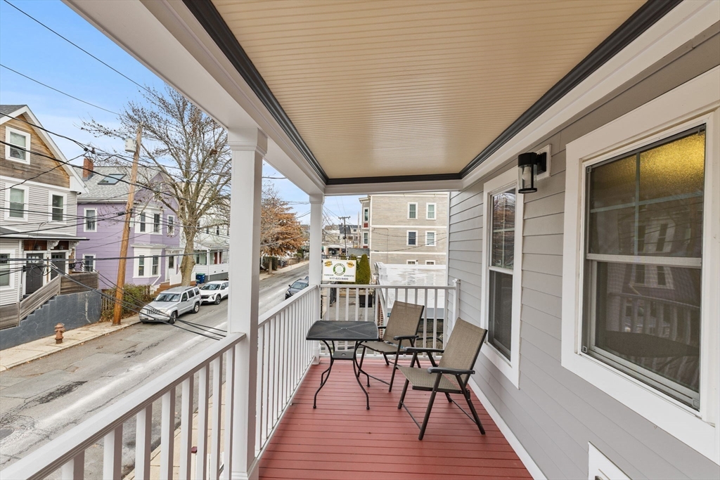 22 Clarendon Avenue, Unit 2 Somerville, MA 02144 - Photo 10 of 17 a view of a balcony with chairs