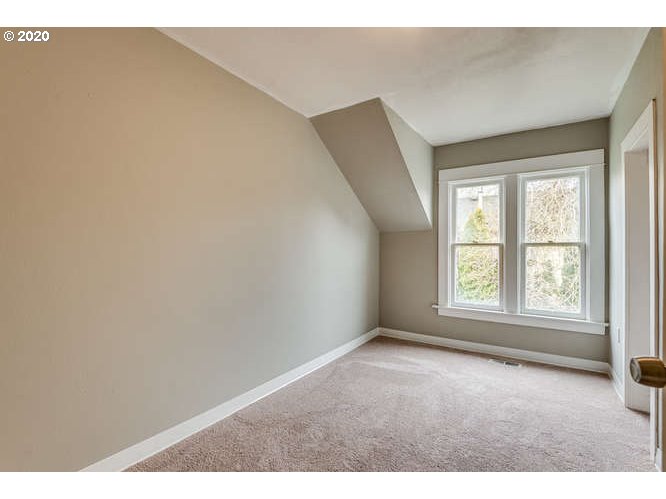 481 South Pine Street Canby, OR 97013 - Photo 12 of 17 an empty room with wooden floor and windows