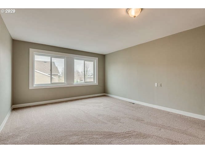 481 South Pine Street Canby, OR 97013 - Photo 13 of 17 a view of an empty room with a window