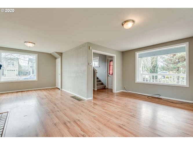 481 South Pine Street Canby, OR 97013 - Photo 5 of 17 a view of an empty room with window and wooden floor
