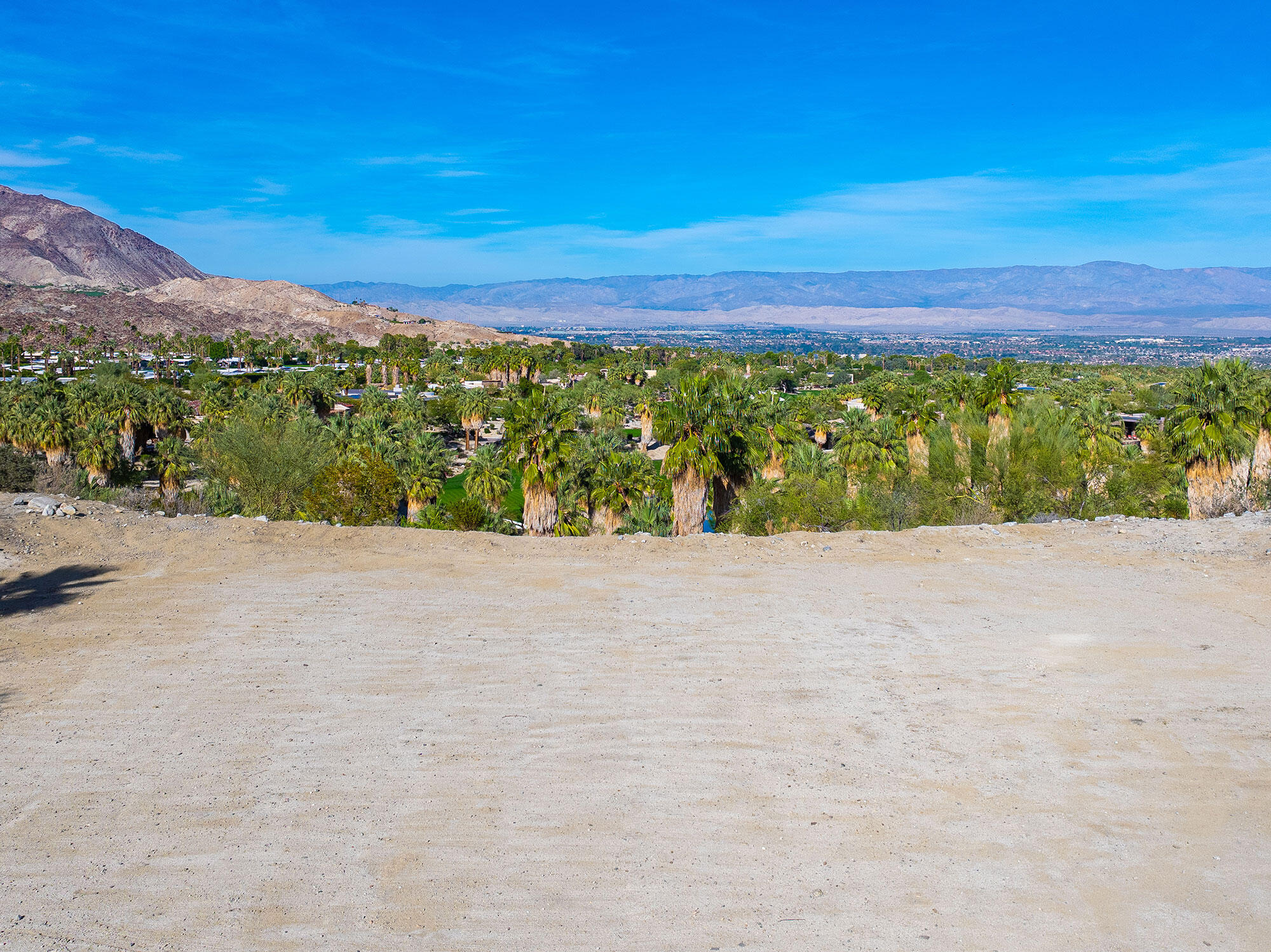 a view of an outdoor space with mountain view in back
