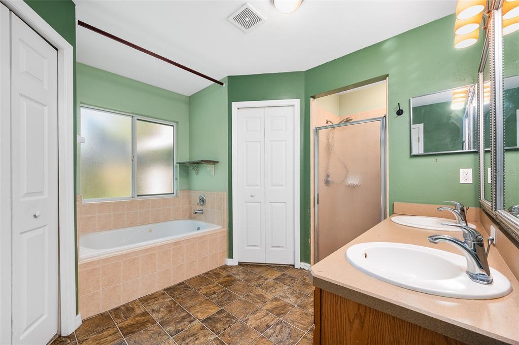 7462 Southwest 84th Drive Gainesville, FL 32608 - Photo 16 of 42 a bathroom with a sink and a bathtub