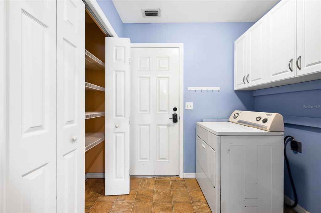 7462 Southwest 84th Drive Gainesville, FL 32608 - Photo 25 of 42 a view of utility room with washer and dryer