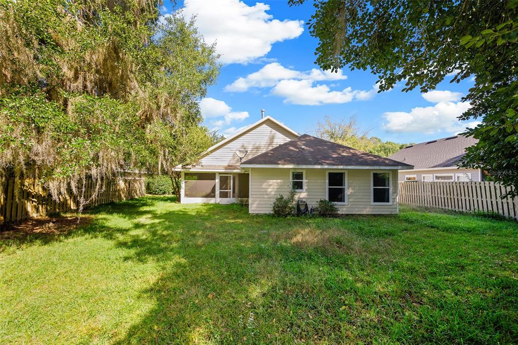 7462 Southwest 84th Drive Gainesville, FL 32608 - Photo 29 of 42 a view of a house with a yard
