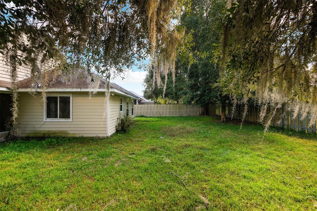 7462 Southwest 84th Drive Gainesville, FL 32608 - Photo 31 of 42 a view of a backyard with a large tree