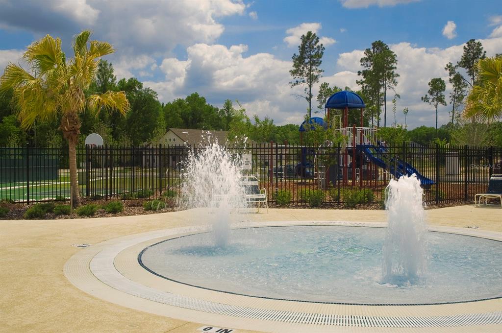 7462 Southwest 84th Drive Gainesville, FL 32608 - Photo 38 of 42 a swimming pool with trees in the background