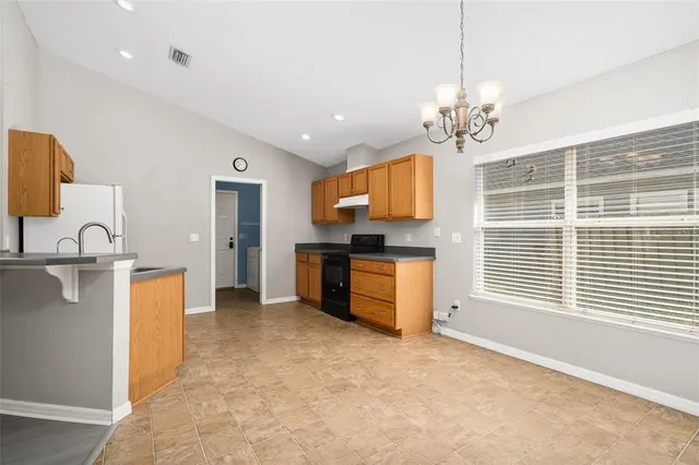 a view of a kitchen with a sink cabinets and a kitchen