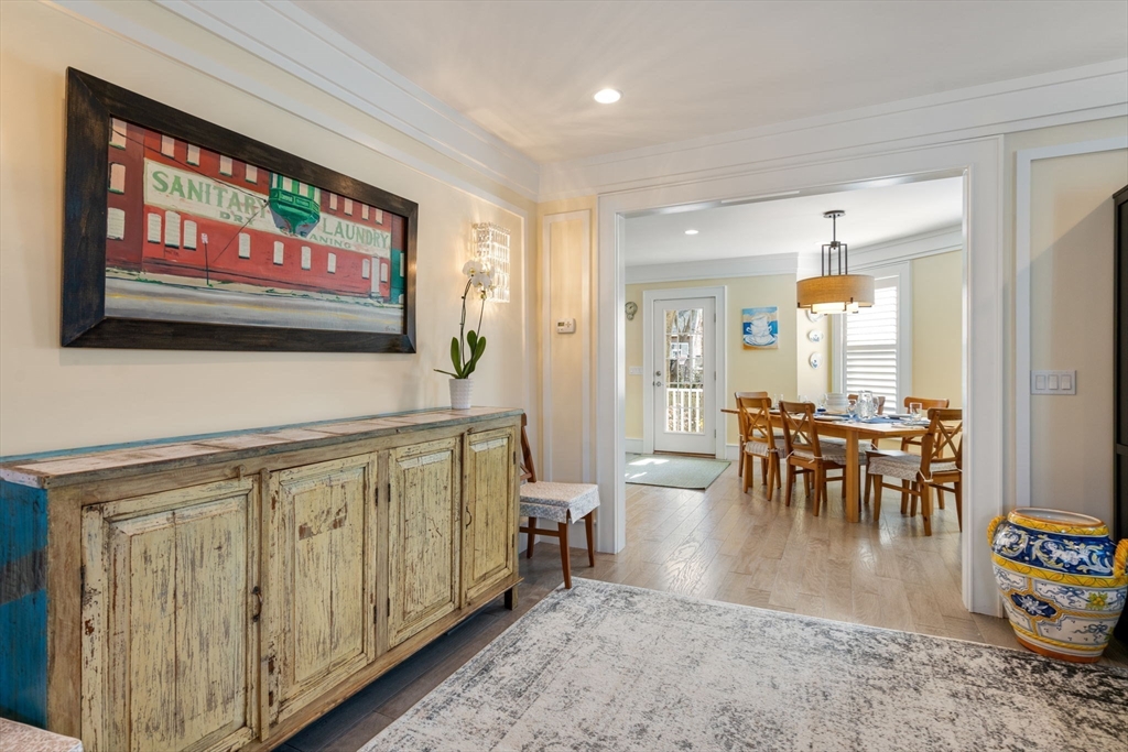 1404 Centre Street Newton, MA 02459 - Photo 12 of 42 a view of a a dining room with furniture wooden floor and a rug