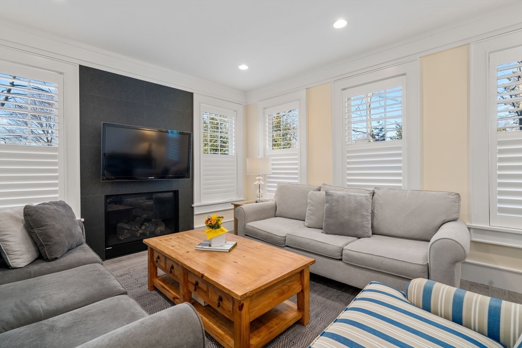 1404 Centre Street Newton, MA 02459 - Photo 15 of 42 a living room with furniture and a flat screen tv