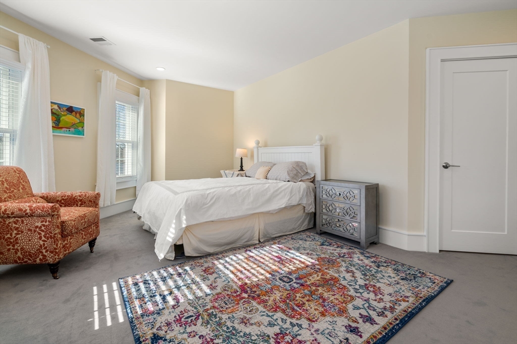 1404 Centre Street Newton, MA 02459 - Photo 20 of 42 a bedroom with a bed and a couch