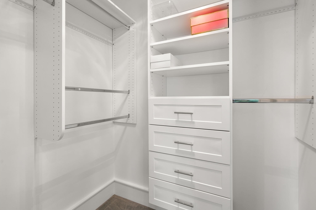 1404 Centre Street Newton, MA 02459 - Photo 21 of 42 a view of walk in closet with empty racks