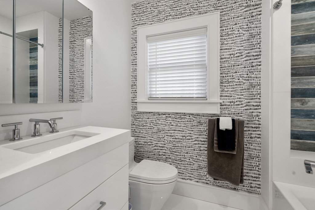 1404 Centre Street Newton, MA 02459 - Photo 27 of 42 a bathroom with a sink a toilet and shower