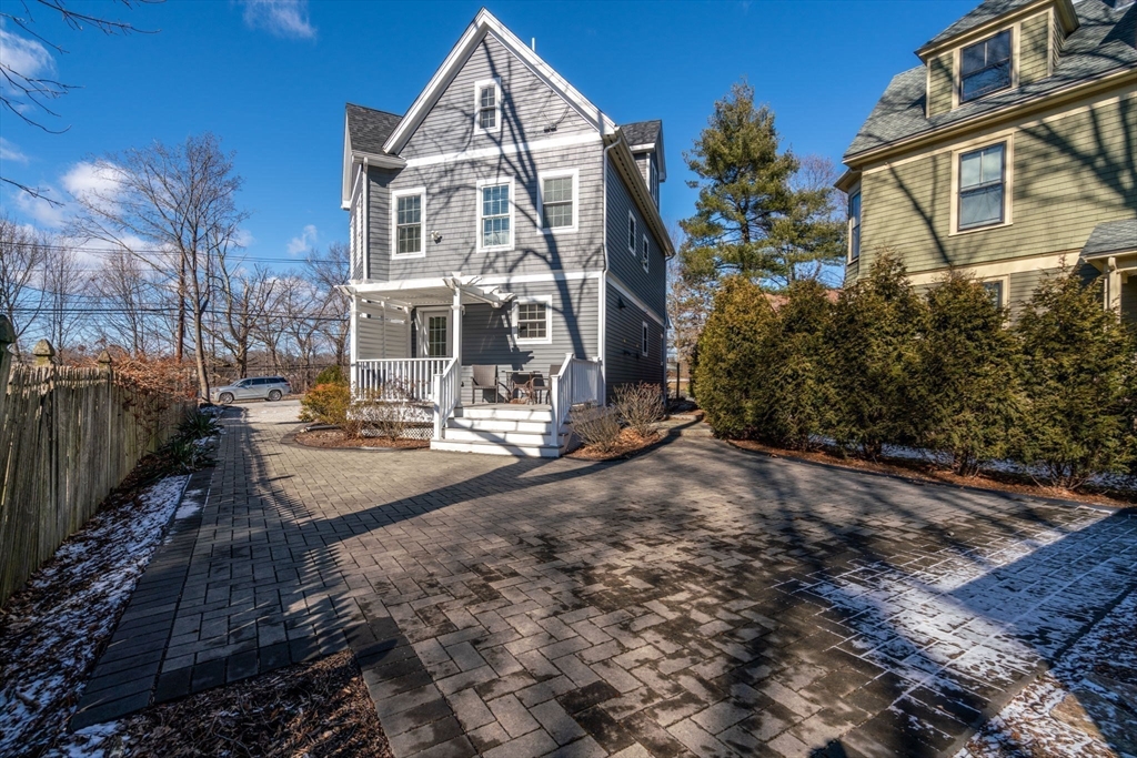 1404 Centre Street Newton, MA 02459 - Photo 32 of 42 a front view of a house with a yard