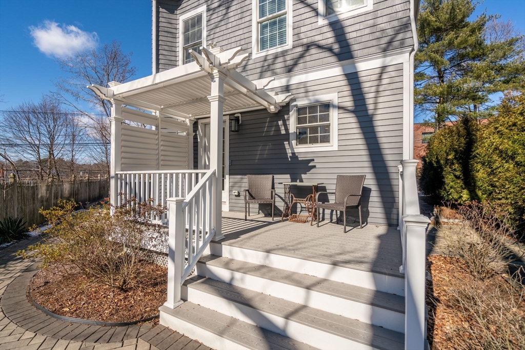 1404 Centre Street Newton, MA 02459 - Photo 33 of 42 a view of a house with backyard and sitting area